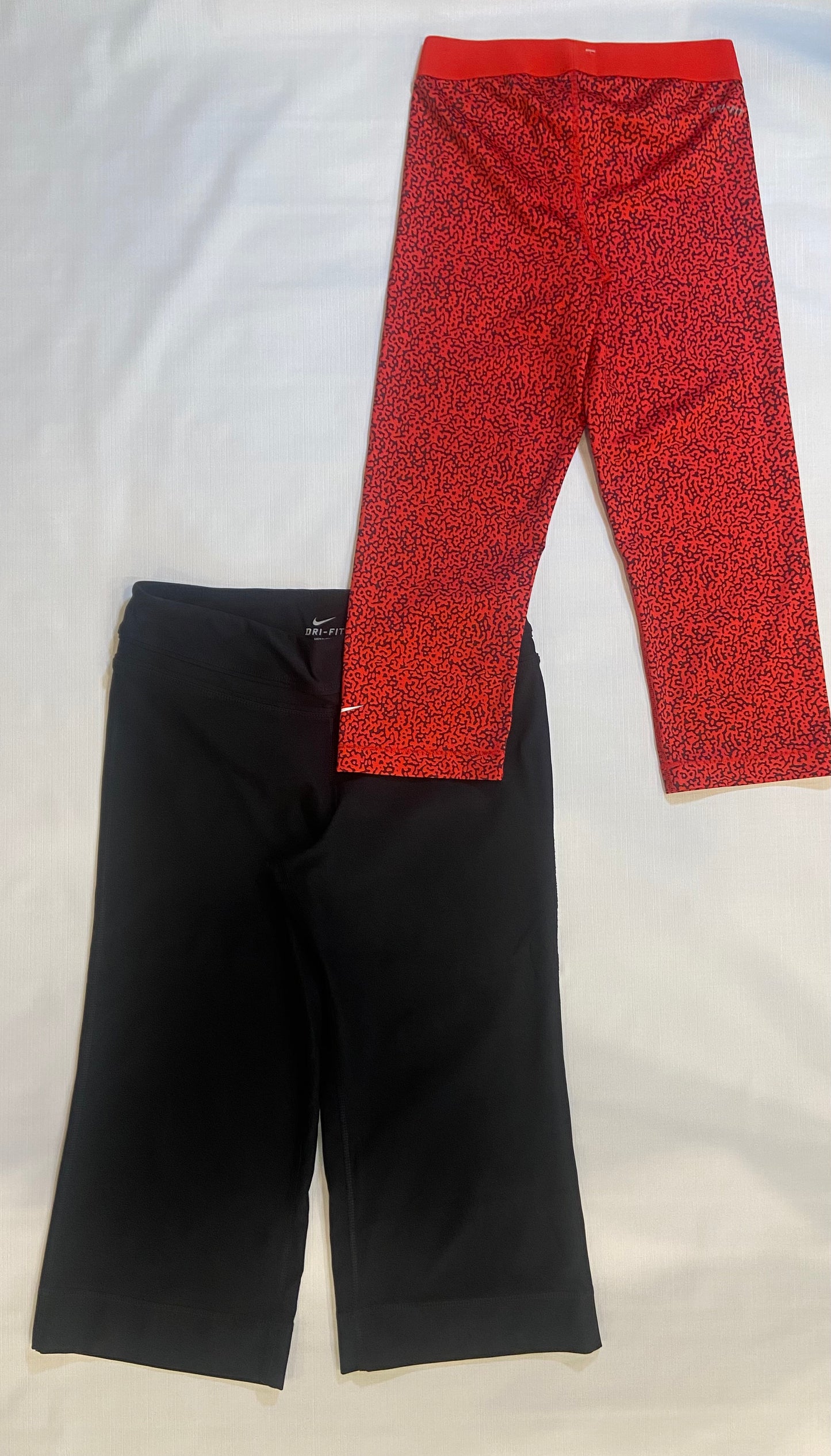 Lot of 2- Nike Women’s Athletic Capri’s Sizes Small (Red,Cheetah Print, NWT) (Black, NWOT)