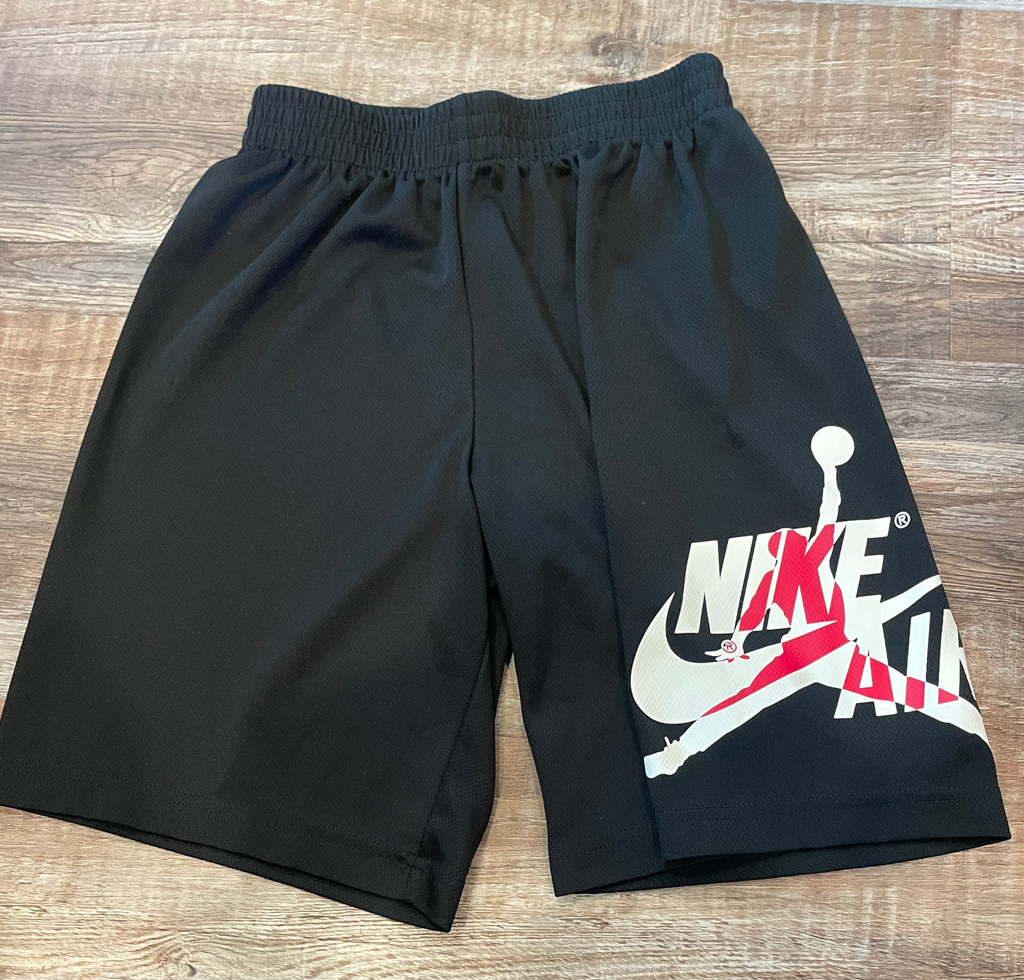 NIKE Black Shorts with Jordan/Nike logo on one leg boys size Large